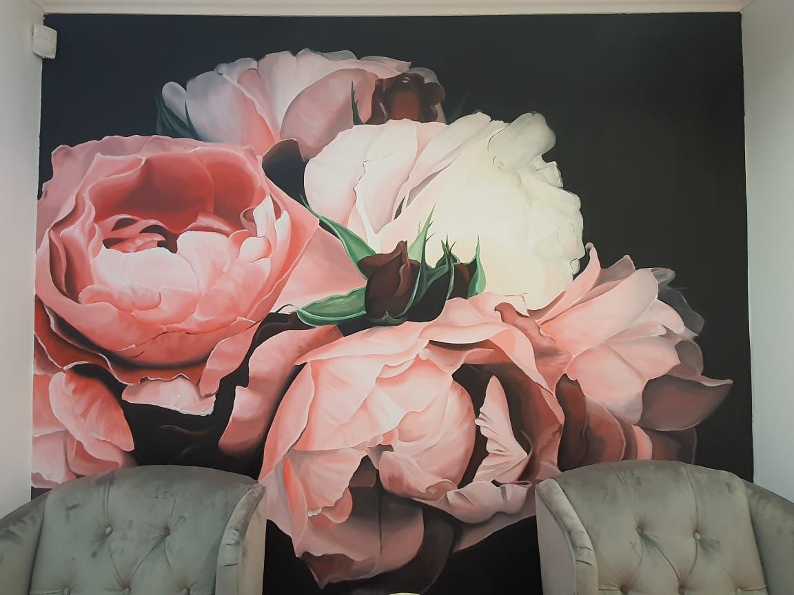 Pink floral feature wall inside Face and Body Studio SA
